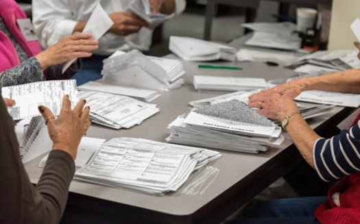 A measure designed to protect election workers in Oregon is awaiting Gov. Brown's signature. (MyPhotoBuddy/Adobe Stock)