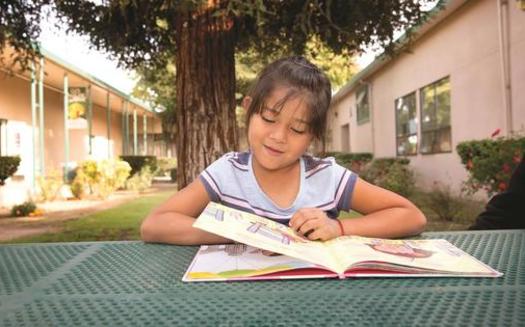A child reads during one of Save the Children's after-school programs in Central Valley California. (Tamar Levine/Save the Children)