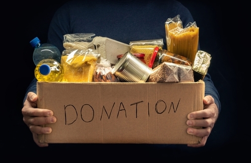 Since the National Association of Letter Carriers began participating in the annual Stamp Out Hunger Food Drive, they have collected an estimated 1.8 billion pounds of food for families in need. (Andrii/Adobe stock)