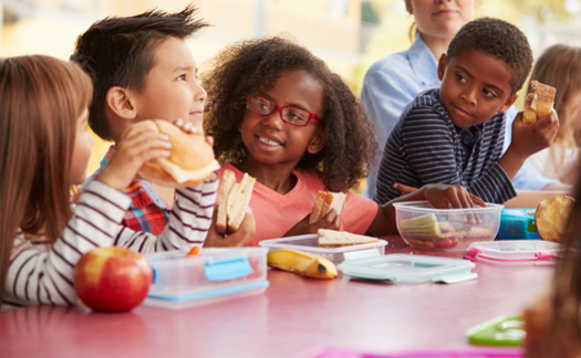 Omaha Public Schools reported that being able to offer meals to all students at no charge reduced childhood hunger, supported academic achievement, eliminated stigma associated with school meals and improved student behavior. (Adobe Stock)
