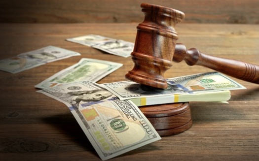 Juvenile-justice advocates in Michigan urge policy action on the issue of youth and families having too many court fines and fees to pay off. (Alex/Adobe Stock)