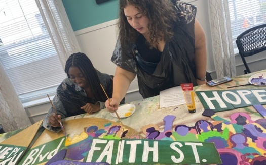 Community members work on a peace mural for the Louis D. Brown Peace Institute. Along with the Boston Public Health Commission, the group offers a Survivors Outreach Services program to deliver coordinated services to families affected by homicide. (Louis D. Brown Peace Institute)