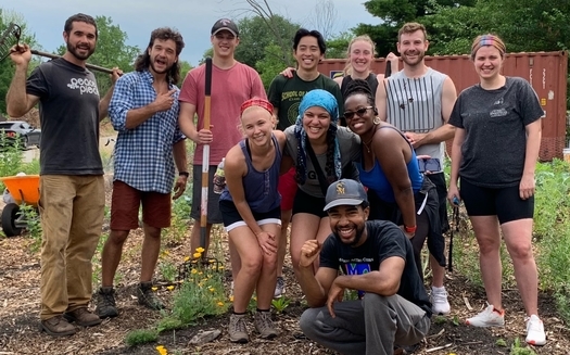 Jon Kent (kneeling) and a cadre of volunteers are raising vegetables and feeding the community from their urban farm at Charlevoix and Lakeview streets in East Detroit. (Sanctuary Farms)