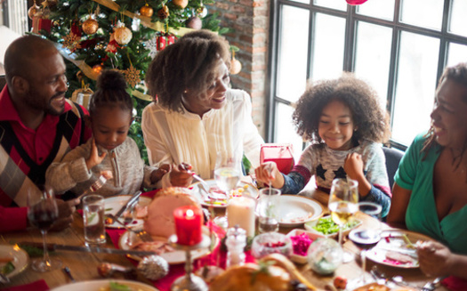 Research has shown gatherings where people are eating and drinking can increase the risk of getting and spreading COVID-19 among people who are not fully vaccinated. (Adobe Stock)