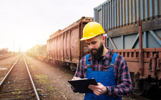 Union leaders representing the nation's railroad workers say it's nearly impossible for members to get time off, given the industry's staffing crunches. (Adobe Stock)