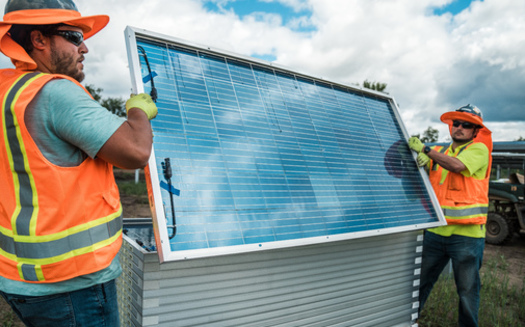 Workers in July helped with installation at a 15-megawatt solar construction site owned by Minnesota Power in Sylvan, near Brainerd. (Photo courtesy of CEEM)
