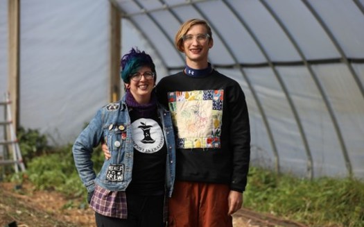 Shannon Mingalone, left, and Eve Mingalone are seen in their hoop house at their business Ramshackle Farm in Harvard, Illinois, on Oct. 19, 2022. (Photo courtesy of Coburn Dukehart/Wisconsin Watch)