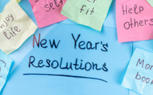 Resolutions that focus on helping others can help people be less materialistic. (ricka_kinamoto/Adobe Stock)