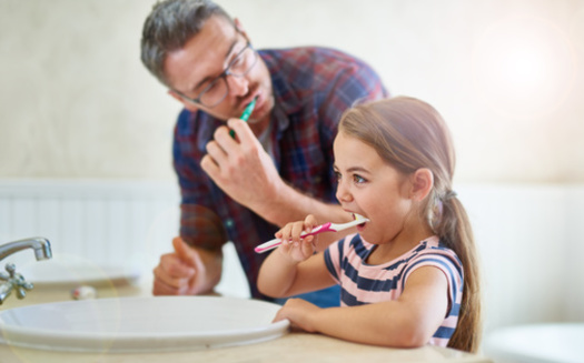 The CDC recommends parents assist children under age 6 with brushing their teeth until they have developed good brushing skills. (Cecilie Skjold Wackerhausen/Adobe Stock)