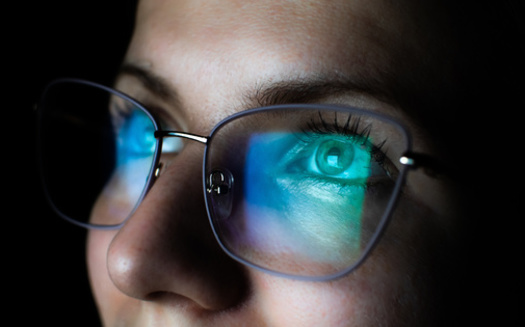 People who experience fatigue from long duration screen use can consider blue light reading glasses that filter blue light and reduce glare. (Adobe Stock)