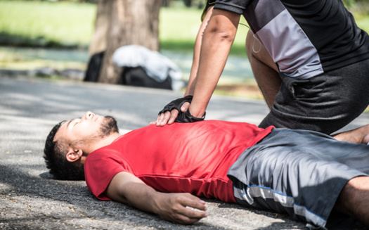According to the American Heart Association, in the case of cardiac arrest, calling 911 immediately and performing chest compressions until paramedics arrive and can use a defibrillator to shock the heart back into a normal rhythm can reverse cardiac arrest if done within a few minutes. (Adobe Stock)