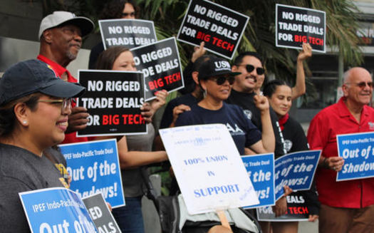 Labor, consumer and environmental advocates rallied in front of the APEC meeting in Los Angeles last September. (Will Wiltschko)