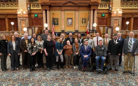 Members of the Iowa Developmental Disabilities Council attend the signing of House Resolution 9 at the State Capitol, observing March as Developmental Disabilities Awareness month in Iowa. (Iowa Developmental Disabilities Council)