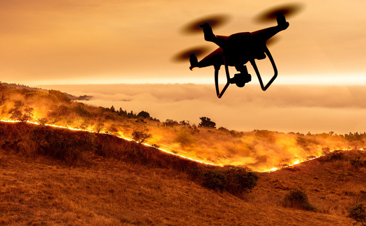 Wildfire experts plan to use unmanned drones to help improve early detection, battle fires more effectively, and to reseed and restore scarred forests. (Windsong/Adobe Stock)
