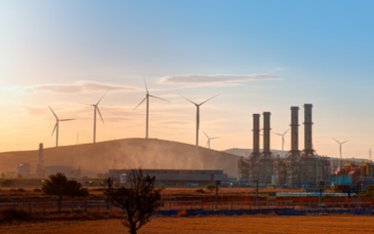 A new report finds the Regional Greenhouse Gas Initiative has created a 50% increase in economic growth per capita for the 12 states in it. However, experts worry it isn't as effective in helping communities living with the effects of power plant emissions. (Adobe Stock)