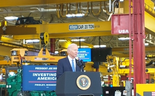 President Joe Biden speaks to an audience gathered at the Cummins Inc. facility in the Minneapolis suburb of Fridley. He was there to tout his administration's policies that offer investments in manufacturing, infrastructure and clean-energy technology. (Mike Moen/PNS)