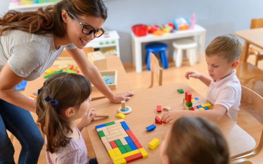 Child care workers have been forced out of the profession in some cases because of the low pay. (lordn/Adobe Stock)