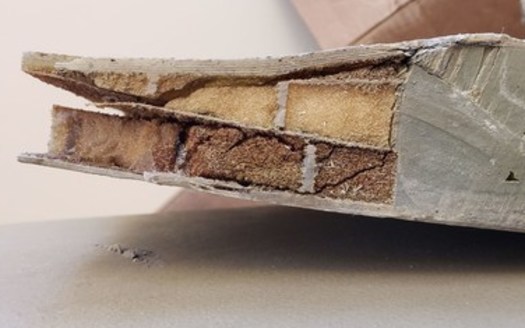 Researchers in North Dakota say they've been able to examine the structures of two decommissioned wind blades in different conditions. Inside, they found materials such as thick layers of Fiberglas and balsa wood or foam, sandwiched between thin layers of Fiberglas. (Photo courtesy of EERC)