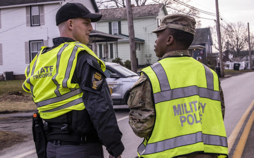 Ohio Army National Guard and Ohio State Highway Patrol officers assist with traffic control after the train derailment in East Palestine. (Flickr/Ohio National Guard)<br />