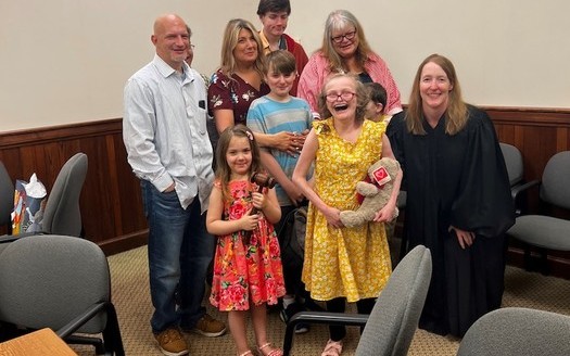 Samantha, in the yellow dress, on her adoption day. The Dave Thomas Foundation is celebrating reaching 13,000 adoptions in both the United States and Canada.(Aaryn McGregor)