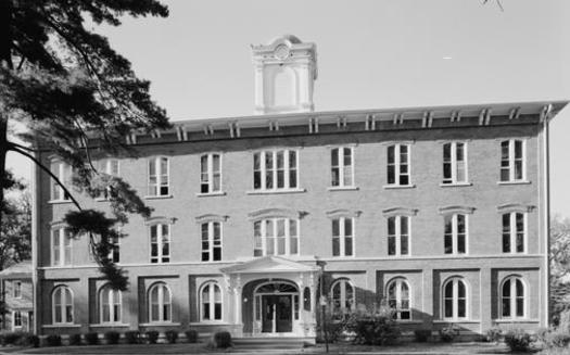 Iowa Wesleyan University was able to continue operating after receiving donations from alumni and a $26 million USDA loan. In 2023, the university's board of trustees voted unanimously in favor of closure after Gov. Kim Reynolds determined that a loan of $12 million would not be feasible. (Old Main Hall at Wesleyan University/Library of Congress) 