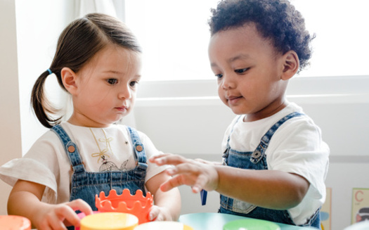 The child care crisis is costing the American economy $122 billion a year in lost earnings, productivity and tax revenue and putting great stress on parents, according to a new report. (Adobe Stock)