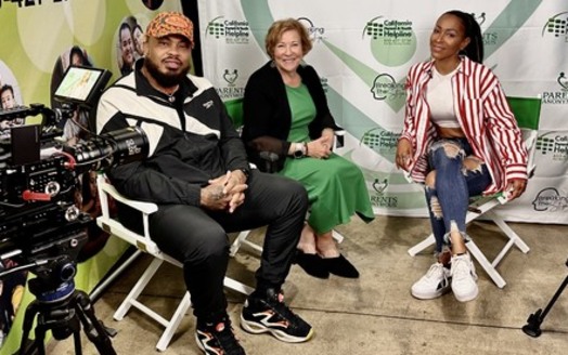 DJ Mike Gdnes and co-hose Dr. Lisa Pion-Berlin interview singer/songwriter Amina Buddafly for the podcast 
