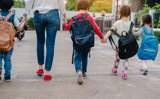 A trusted adult can be an important resource for kids during their first week of school. (Kiattisak/Adobe Stock)
