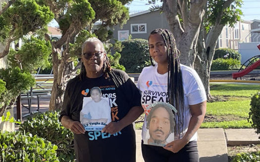 The data shows that victims of youth crime rarely receive full financial restitution. The Edwards family holds photos of lost loved ones at a picnic for crime survivors in Los Angeles last weekend. (LaNaisha Edwards)