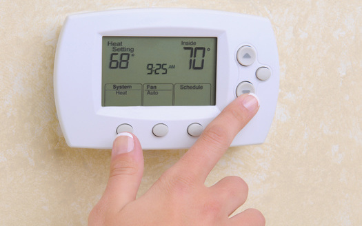 Beyond insulation and furnace repairs, programmable thermostats are part of home weatherization services to help establish more energy efficiency. (Adobe Stock)