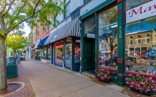 Policy analysts say if retail chains flood too many small towns, pushing out Main Street businesses in the process, these communities could lose tourists looking for places like boutiques and independent bookstores. (Adobe Stock)