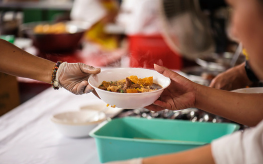 Food banks provide a crucial service, but federal programs such as SNAP are critical to fighting hunger. (kuarmungadd/Adobe Stock)