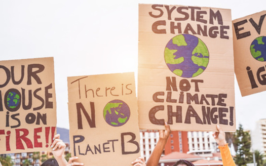 When fossil fuels are burned, they release large amounts of carbon dioxide, a greenhouse gas, into the air. Greenhouse gases trap heat in the atmosphere, causing global warming. (Adobe Stock) 