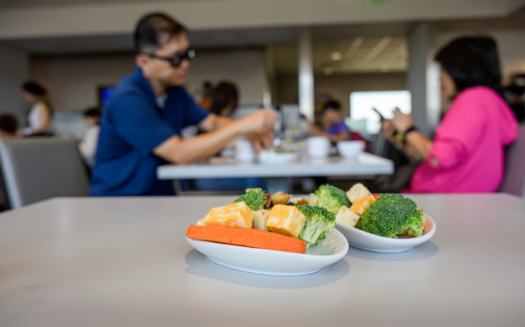 If your flight is delayed this holiday travel season, experts recommended people with chronic health conditions pack or seek out airport vendors selling healthy snacks. They said it can help reduce the risk of a health problem during your trip. (Adobe Stock)