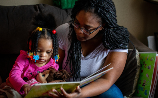Parents are the first and most important teachers for their children. As part of the Early Steps to School Success program, a mother reads with her daughter at home. (Save The Children) 