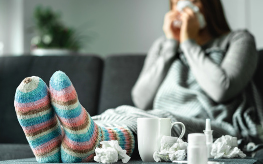Influenza symptoms include fever of at least 100° F., a cough and sore throat, according to the Arizona Department of Health Services. (Adobe Stock) 