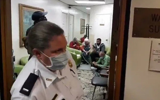 A police officer stands in the doorway of the Washington Surgi-Center during the clinic blockade on Oct. 22, 2020. (We Engage)