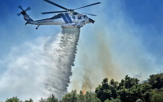 Santa Barbara County Fire Department's Firehawk is shown making a water drop. It can hold 1,000 gallons per trip. (Mike Eliason/Santa Barbara County Fire Dept.)
