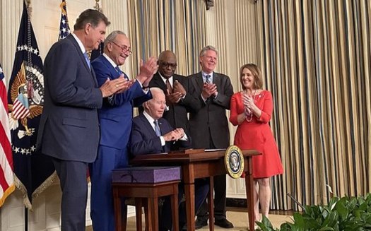 Sen. Joe Manchin, D-W.Va (far left), and other lawmakers join President Joe Biden as he signs the Inflation Reduction Act into law on Aug. 16, 2022. (Energy Secretary Jennifer Granholm/Wikimedia Commons)