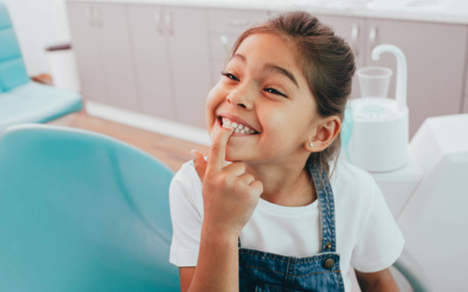 According to the Centers for Disease Control and Prevention, children from low-income families are twice as likely to have cavities in their teeth as those from higher-income families. (Adobe Stock)