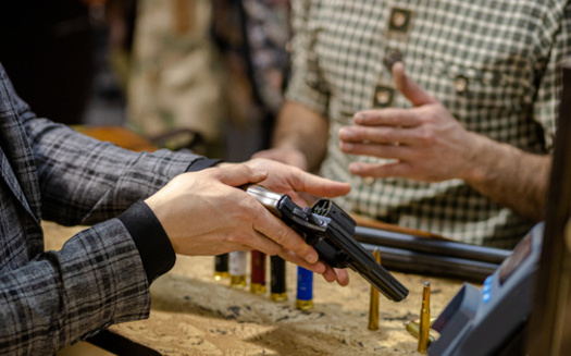 Straw purchases for guns are already a felony under federal law, but Minnesota lawmakers are expressing the need to do the same under state law following the recent fatal shooting of three first responders in a Twin Cities suburb. (Adobe Stock)