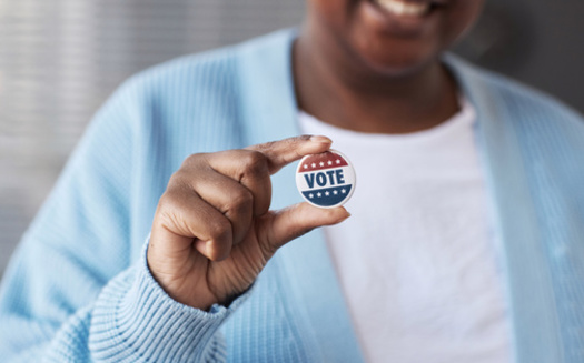 A new poll finds that policies designed to prevent gun violence and improve racial equity are highly important among women voters of color. (Seventyfour/Adobestock)