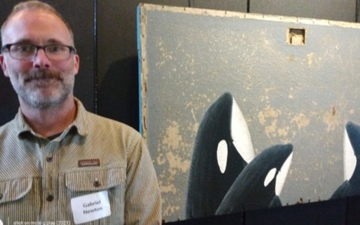 Artist Gabriel Newton used acrylic on found wood to paint Southern Resident orcas, which feed in the Salish Sea. (John Rosapepe/Endangered Species Coalition)