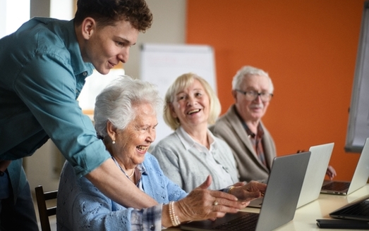 The Empowering the Age group in Gaithersburg funded a program to provide older adults with individualized technology supported by high school students, teaching the adults skills to help them communicate online with family members and medical providers. (Adobe Stock)