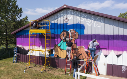 Kids are invited to paint skateboards during the festival, one of many events at RedCan that complements the murals painted by visiting artists. (Cheyenne River Youth Project)