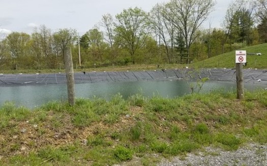 A fracking waste impoundment pond site. Research shows radioactive waste from fracking can spread to groundwater. (FracTracker/Flicker) 