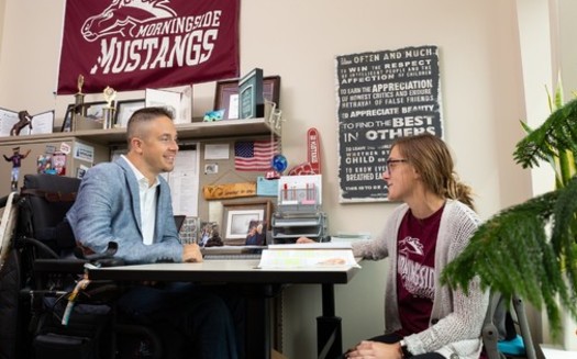 Alex Watters works at Morningside University in Sioux City, Iowa. He says he's had to turn down promotions and other opportunities to keep his income below the threshold that allows him to receive benefits as a quadriplegic. (Alex Watters/IDDC)