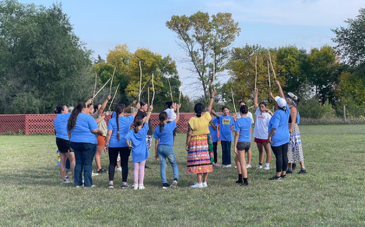 Adults and youth get ready to play double ball during the first annual Indigenous Dakota Games event in Lake Traverse Reservation. (Dustina Gill)