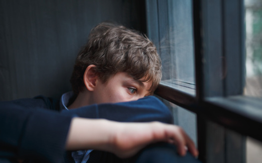 The Illinois Department of Health lists witnessing violence in the home or community or having a family member attempt or die by suicide as examples of adverse childhood experiences. (Adobe Stock)