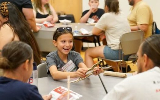 Ava Bruneau plays Ginebig: The Snake Game, a game of chance. Players roll or toss 